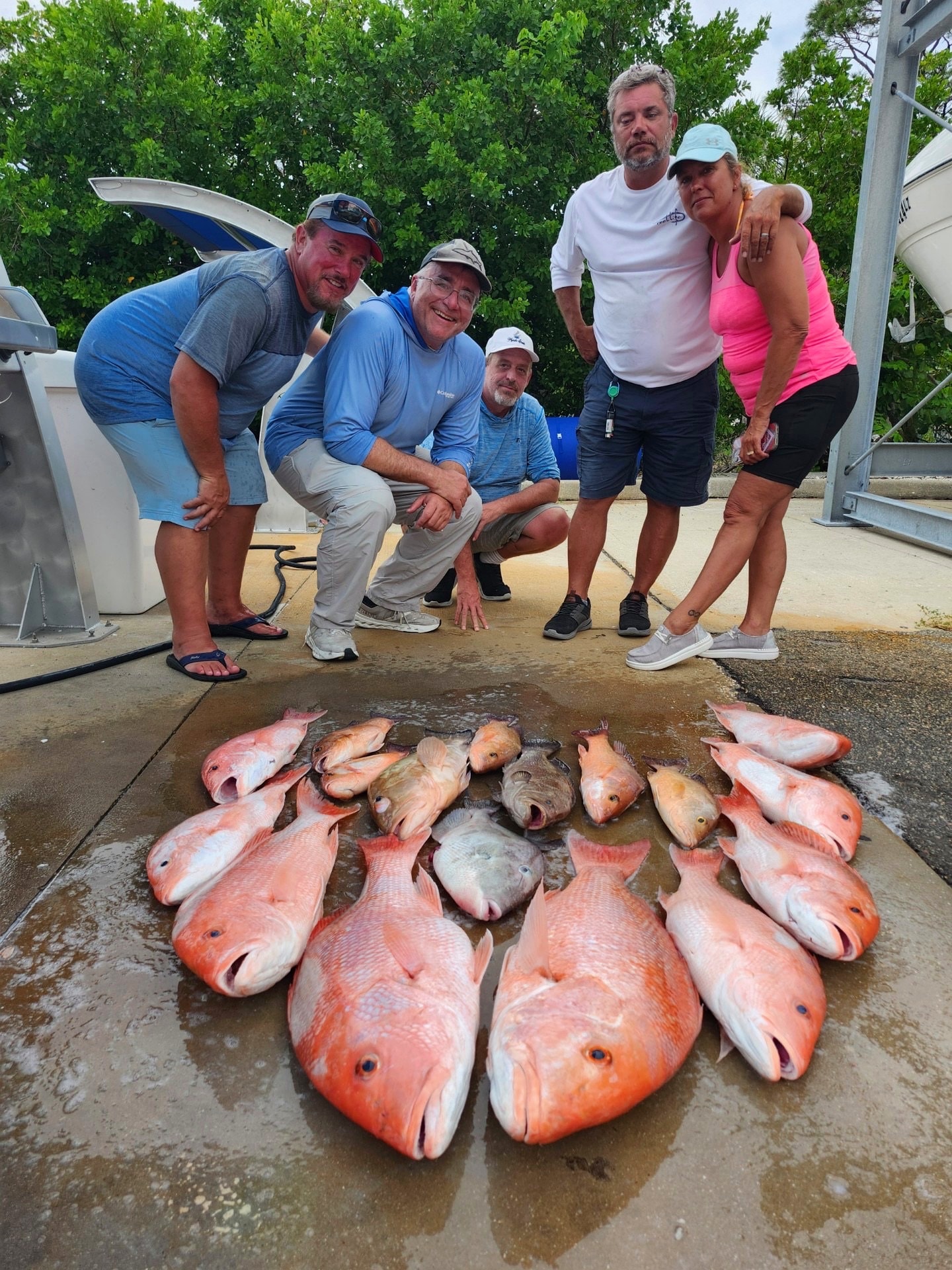 A charter group behind a ring of red snapper and grouper